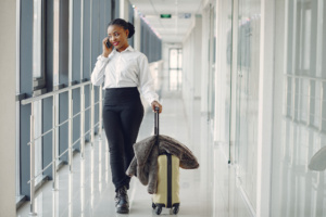 black woman with suitcase airport